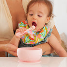 Baby using suction silicone bowl and mini spoon
