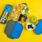 Flatlay lunchbox snackbox and waterbottle in late blue