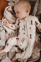 Baby Sleeping wearing Bamboo zipsuit in autumn bear print