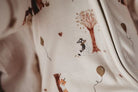 Close up of bamboo zipsuit in autumn bear print