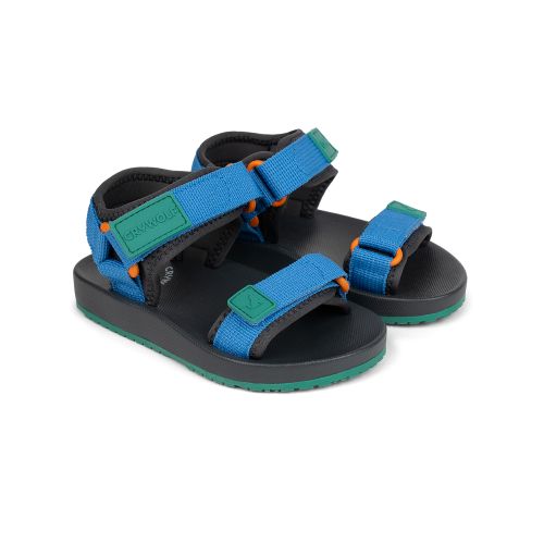 A pair of children's blue and black sandals with green accents and orange details, shown on a plain white background.