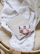 Flatlay of the bump a pregnancy story book