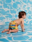 Child wearing the kids boardshorts Chomp