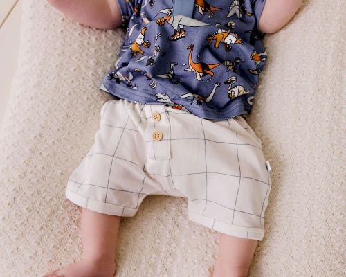 baby wearing the comfy shorts navy grid