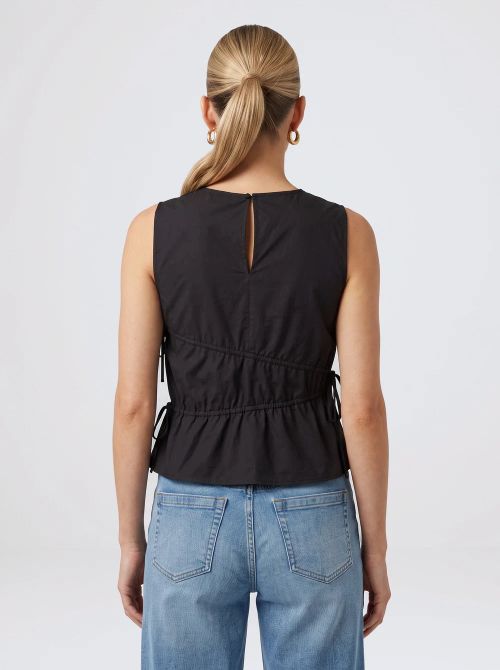 woman wearing the black elin gathered tie top back view