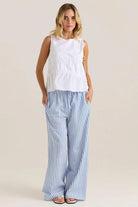 Woman wearing the Elin gathered tie top in white