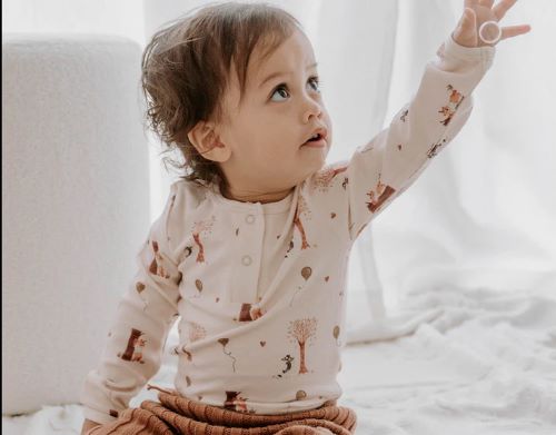 Toddler wearing Henley bodysuit in autumn bear print