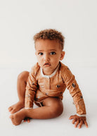 Toddler wearing Henley Bodysuit in bumble bees