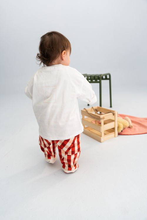 Toddler wearing the long tee in white