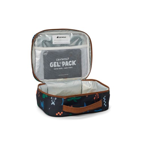 An open insulated lunch bag with a dark navy patterned exterior, brown trim, and a clear mesh top pocket containing a gel pack. The bag has a handle and is photographed on a clean white background.
