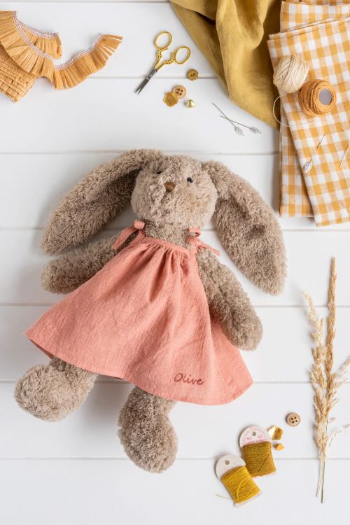 Mrs honey bunny in pink dress flatlay