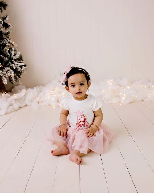 My first christmas bodysuit in pink with a santa