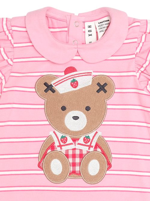 Pink and white striped baby t-shirt with a teddy bear applique wearing a nurse hat and red gingham overalls, featuring a Peter Pan collar and ruffled sleeves.