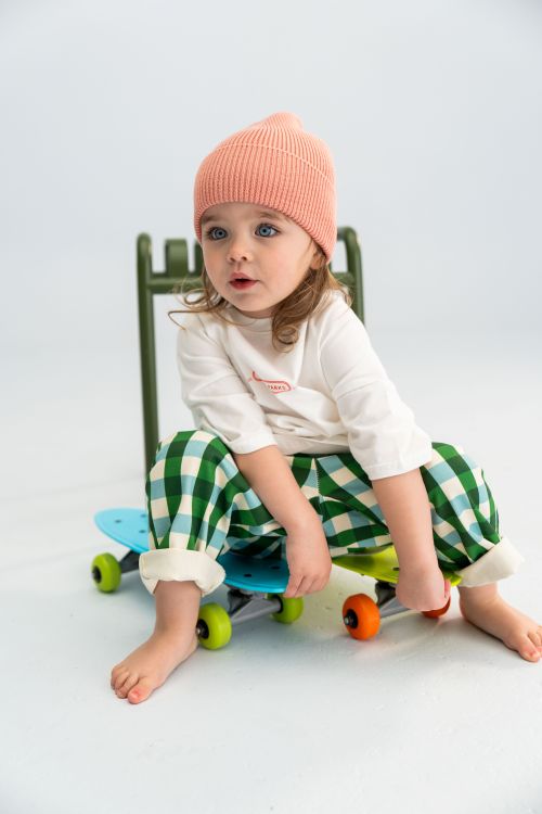 Little girl wearing the picnic twill pants in forest