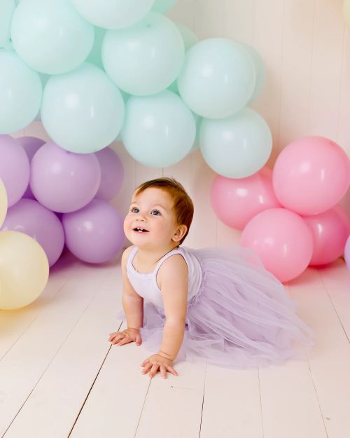 Baby wearing the ribbed tulle dress in lilac